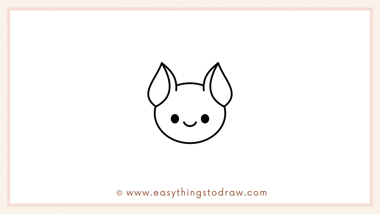 Step 3 of easy bat drawing steps – Drawing two round eyes and a tiny upward curve for a happy mouth.