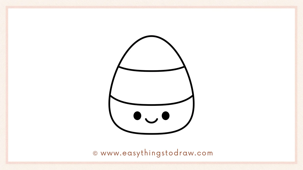 Step 6 of simple candy corn drawing tutorial – drawing two dot eyes and a tiny curved smile in the bottom section.