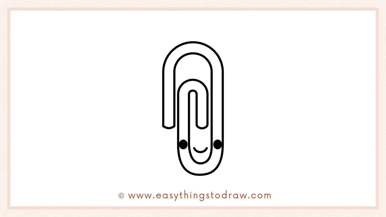 Step 6 of simple paperclip drawing tutorial – Add personality by drawing two cute eyes and a smiling mouth on the paperclip.