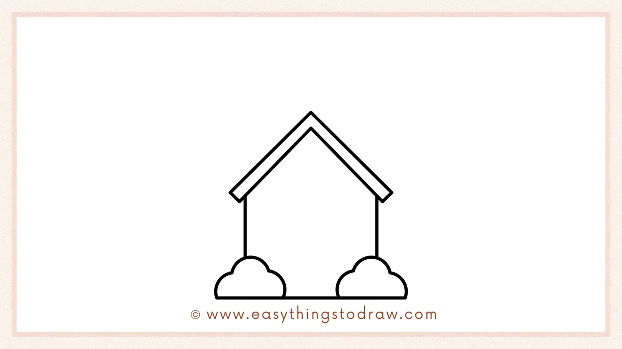 Step 2 of drawing a school building – Adding fluffy cloud shapes for bushes at the base and a second line for the roof border.