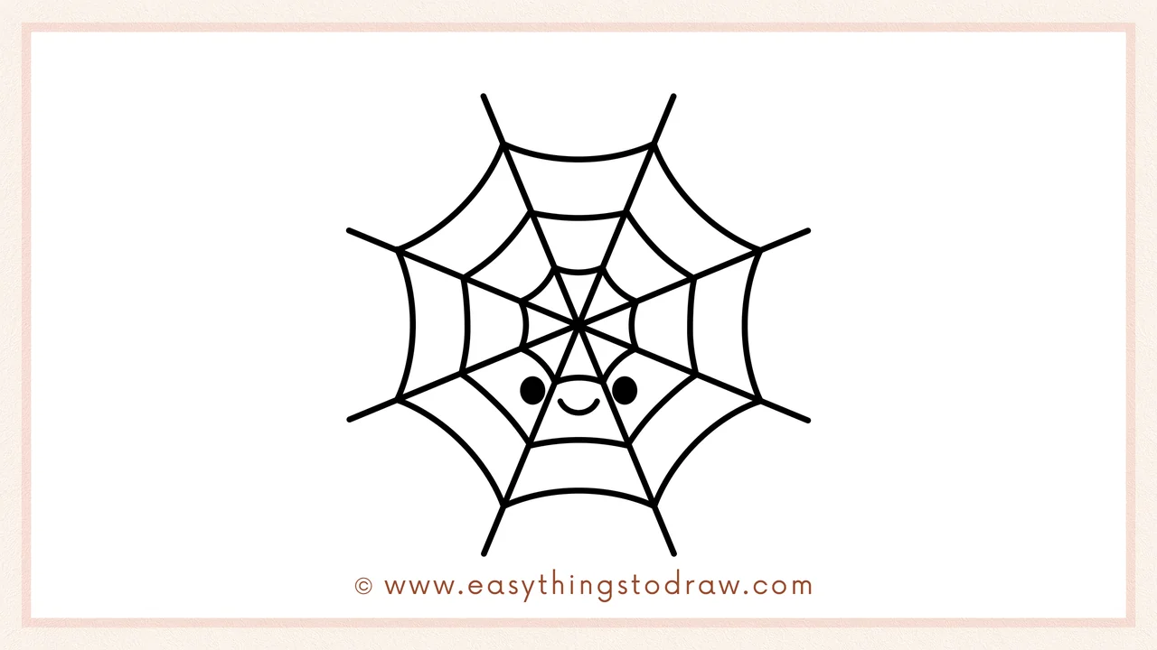 Step 6 of simple spider web drawing tutorial – Draw two round eyes and a smiley mouth in the center for a friendly web.