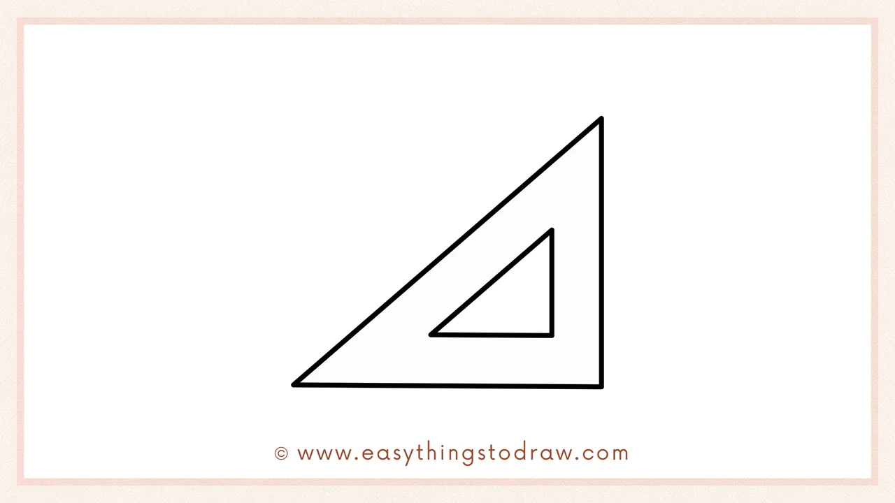 Step 3 of sketching a triangle ruler for beginners – Drawing a smaller inner triangle to create the ruler's hollow center.