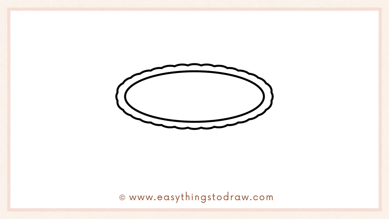 Step 2 of drawing an apple pie – Adding a larger, wavy oval around the first to create the scalloped pie crust edge.