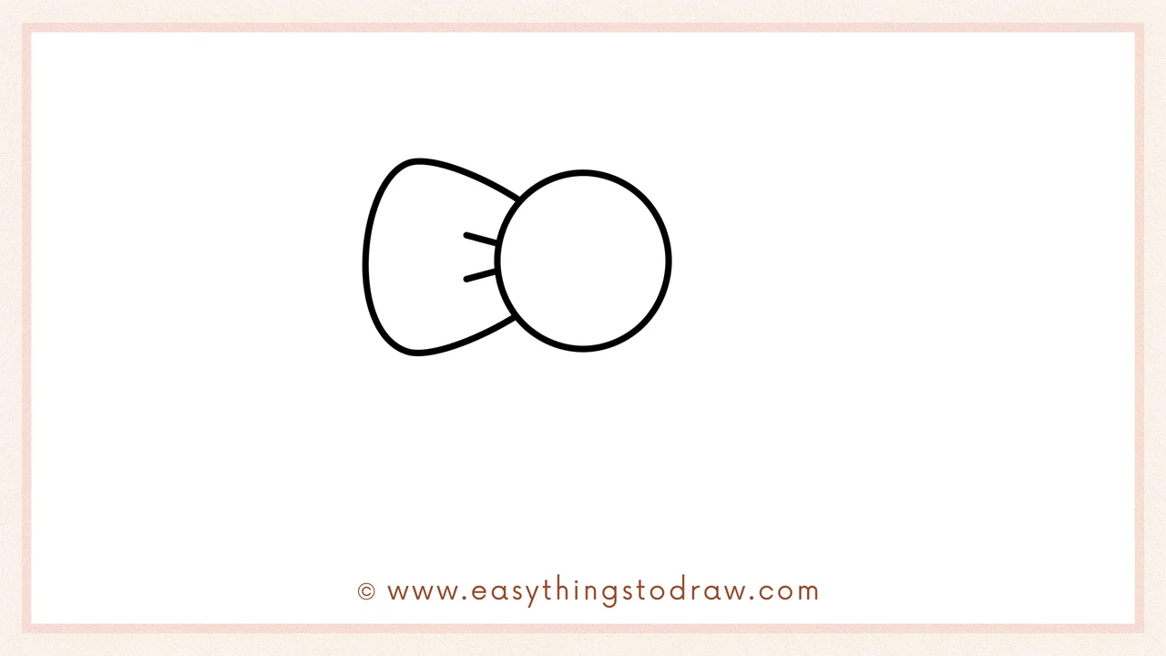 Step 2 of drawing a Christmas bow – Draw a large oval or petal shape for the left loop of the bow.