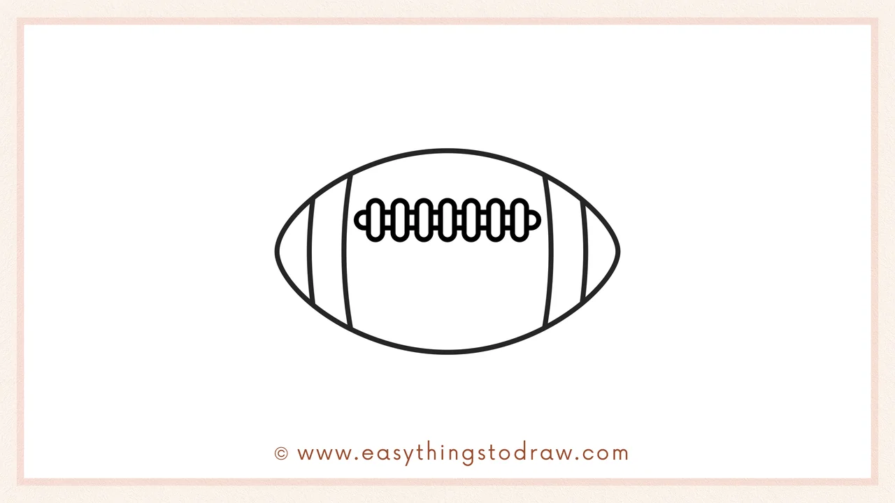 Step 5 of easy football drawing steps – Drawing a vertical line through the stitches to connect the laces.