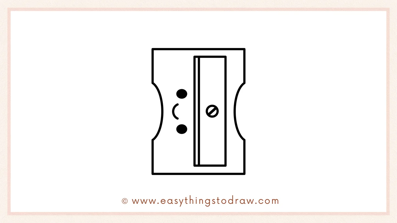 Step 6 of simple pencil sharpener drawing tutorial – adding two dots and a curved line on the left for fun cartoon details.