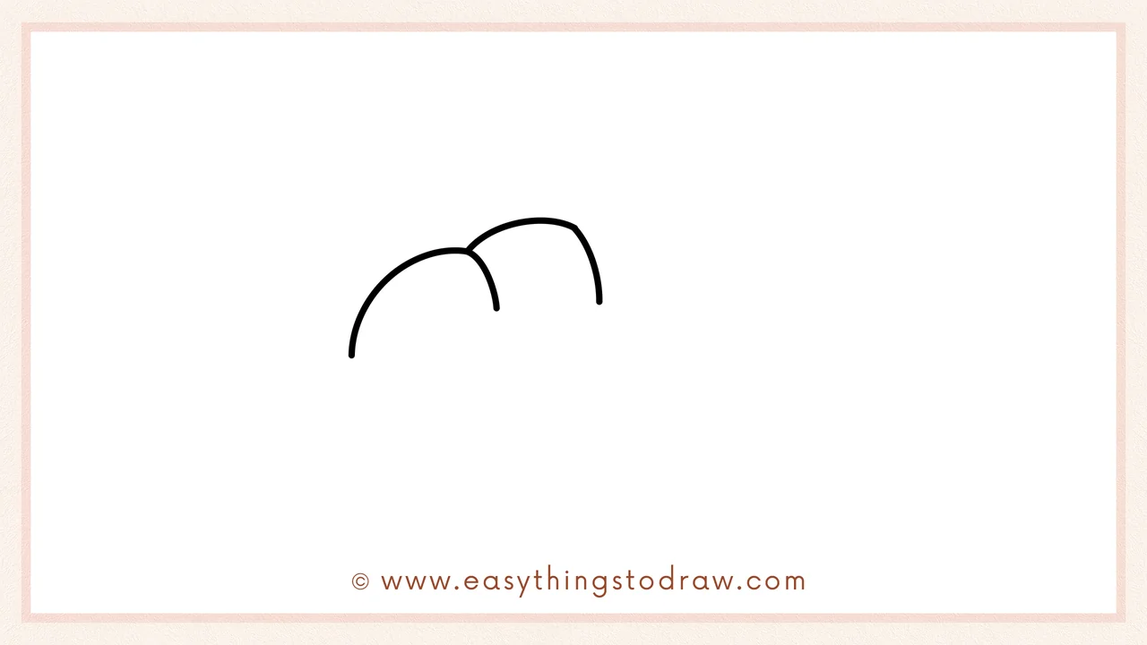 Step 2 of drawing a Thanksgiving bread – Adding another overlapping curved bump to create a fluffy bread top.
