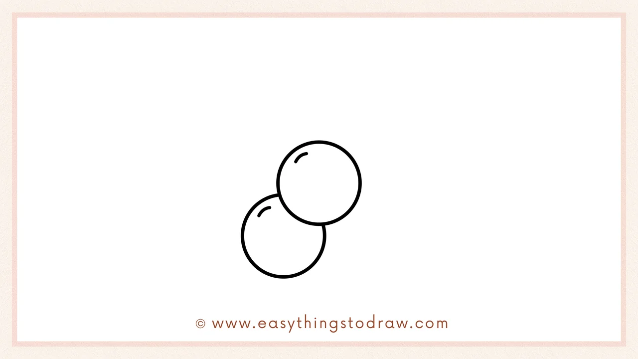 Step 2 of drawing a christmas holly – A second circle is added, slightly overlapping the first one.