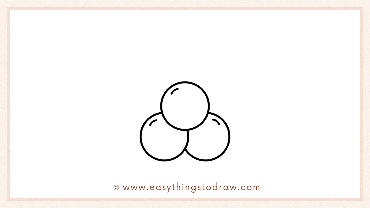 Step 3 of sketching a christmas holly for beginners – A third circle completes the cluster of three berries.