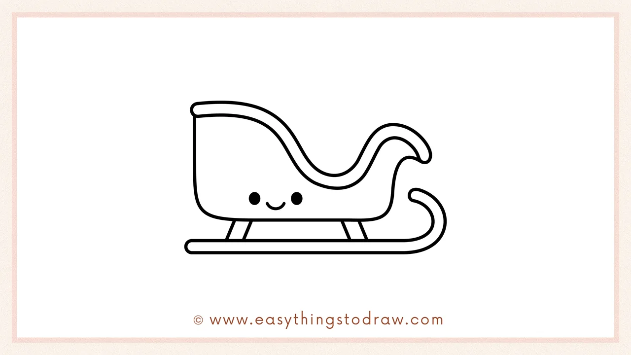 Step 6 of a simple Christmas sleigh drawing tutorial – Adding two oval eyes and a smiling mouth to give the sleigh a happy face.