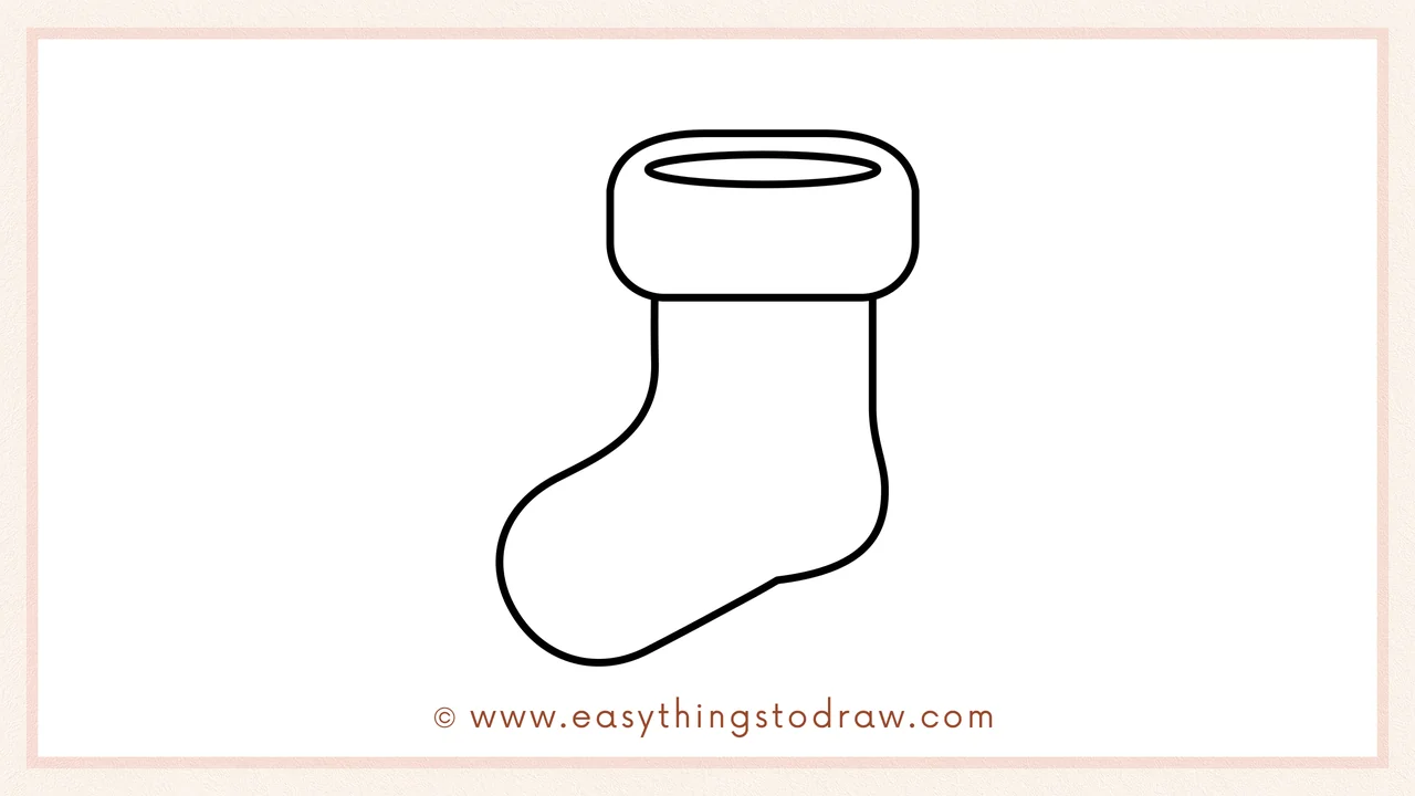 Step 3 of sketching a Christmas stocking for beginners – drawing a curving J-shaped line down from the cuff for the body.