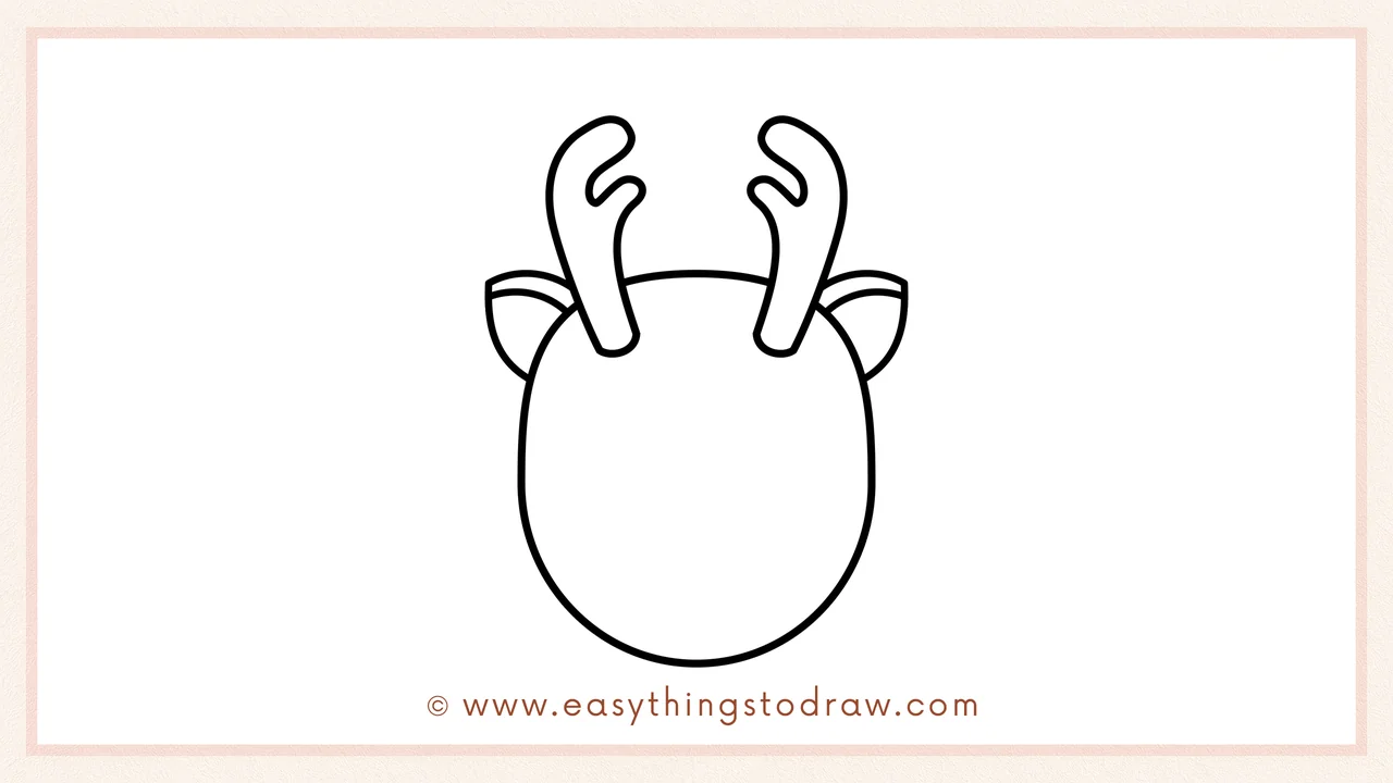 Step 3 of sketching a Rudolph the Red-Nosed Reindeer for beginners – Drawing two pointed ears, one on each side of the head.
