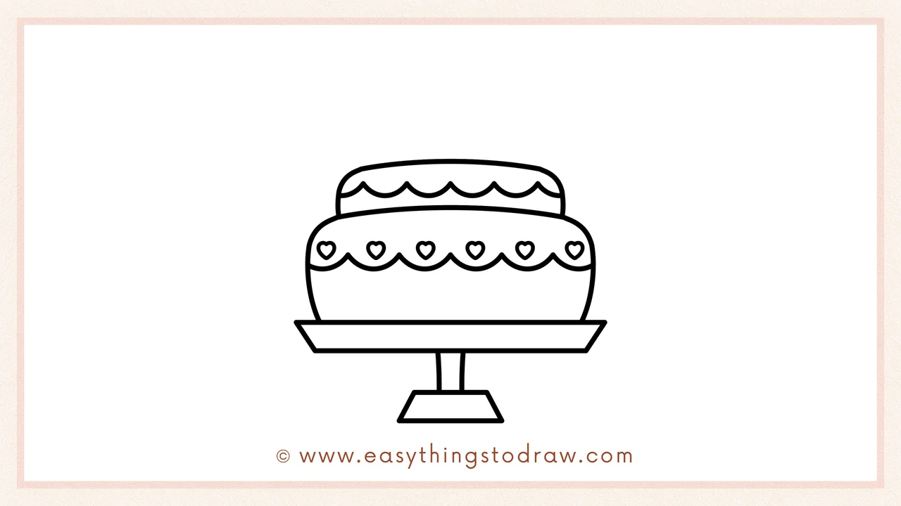 Step 3 of sketching a valentines day cake for beginners – Drawing a smaller rounded rectangle on top for the second layer of icing.