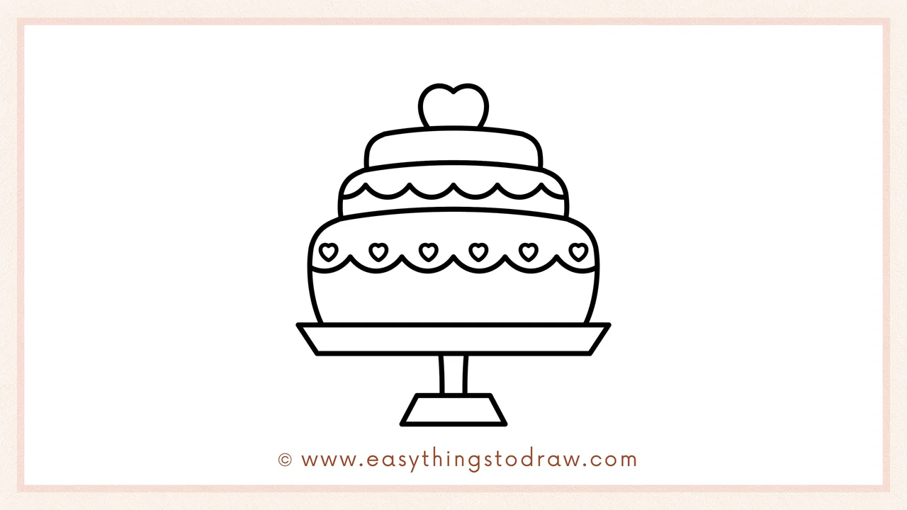 Step 5 of easy valentines day cake drawing steps – Adding a large heart shape on top of the cake as a festive topper.