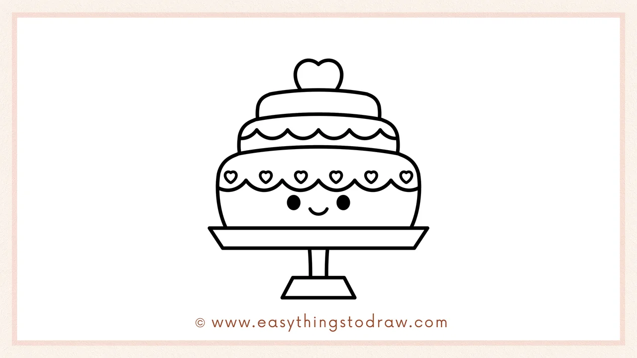 Step 6 of a simple valentines day cake drawing tutorial – Drawing two dot eyes and a smile on the bottom layer to give it a happy face.