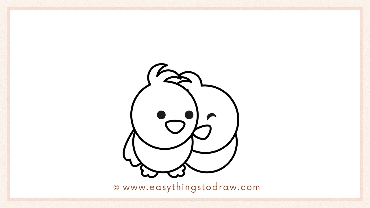 Step 5 of easy love birds drawing steps – sketching a matching oval body for the second bird, positioned to look like a snuggle.