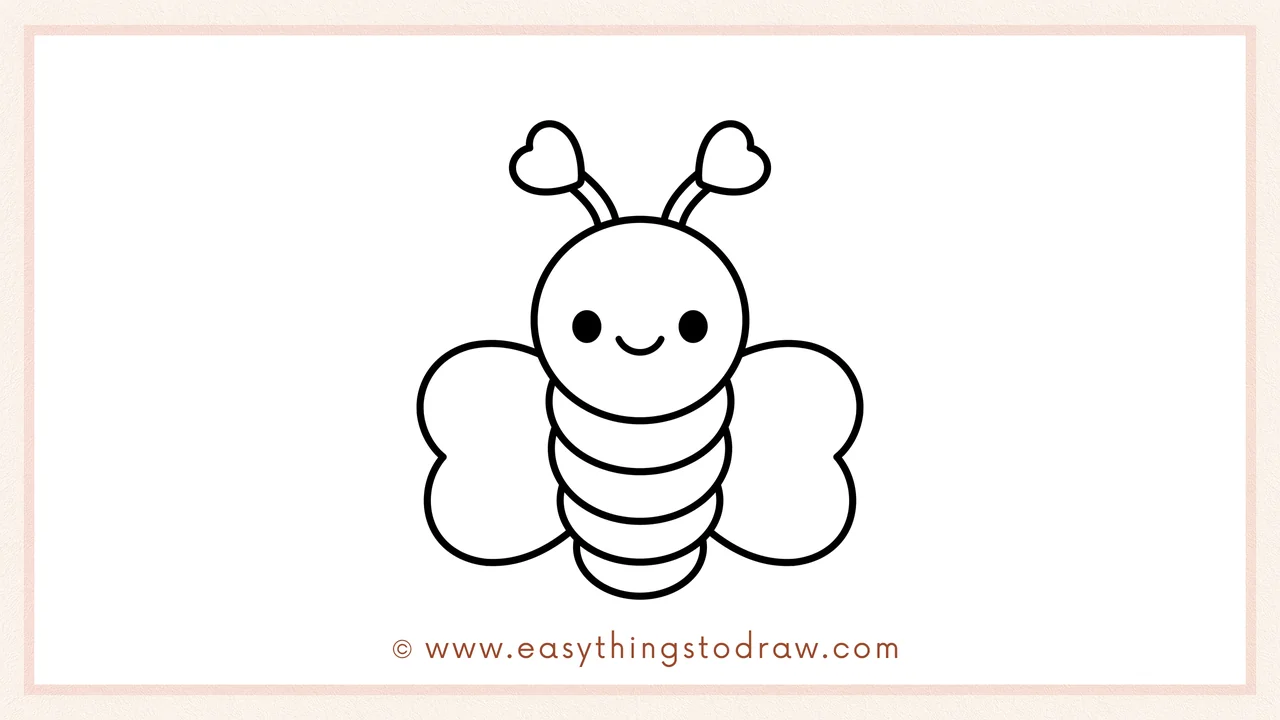 Step 5 of easy love bug drawing steps – A matching heart-shaped wing is drawn on the right side of the body.