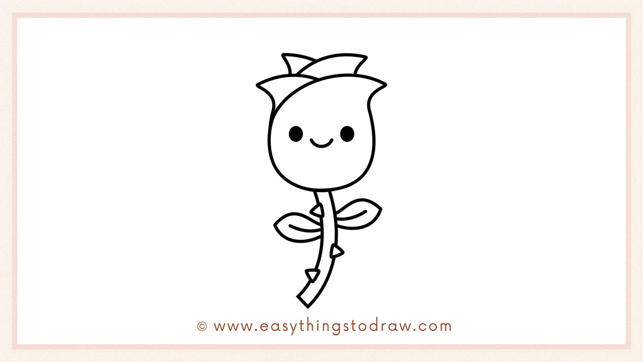 Step 6 of a simple rose drawing tutorial – Draw two small round eyes and a smiling mouth on the rosebud to add a cute face.