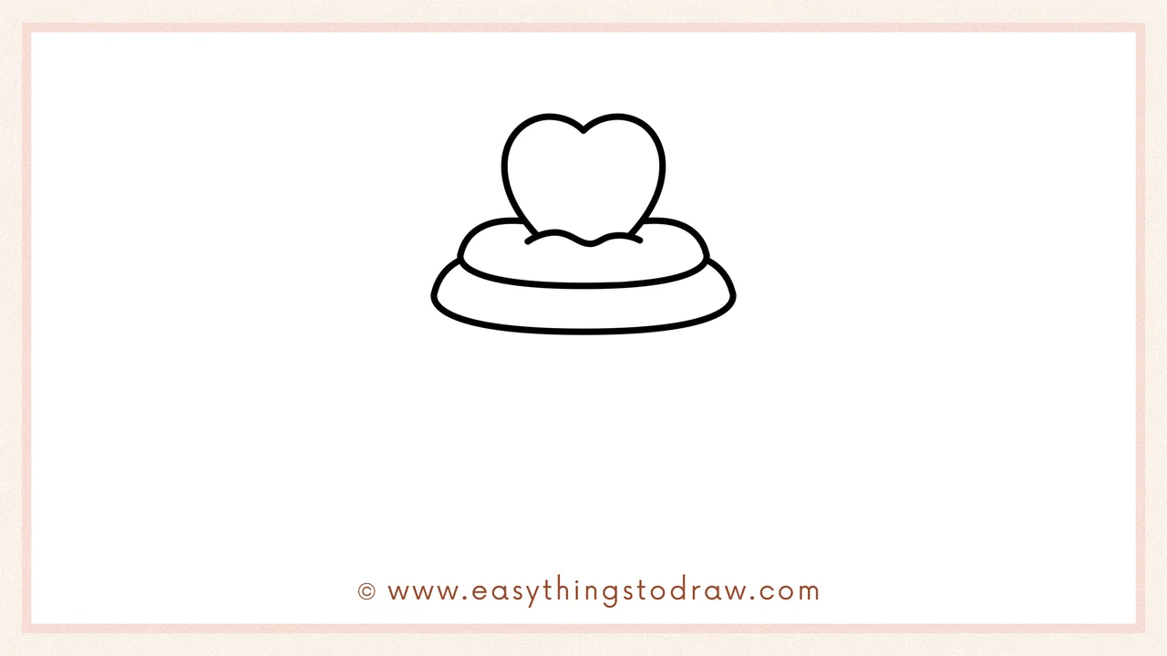 Step 3 of sketching a valentines cupcake for beginners – Adding a second, slightly wider oval layer below the first one to build the frosting.