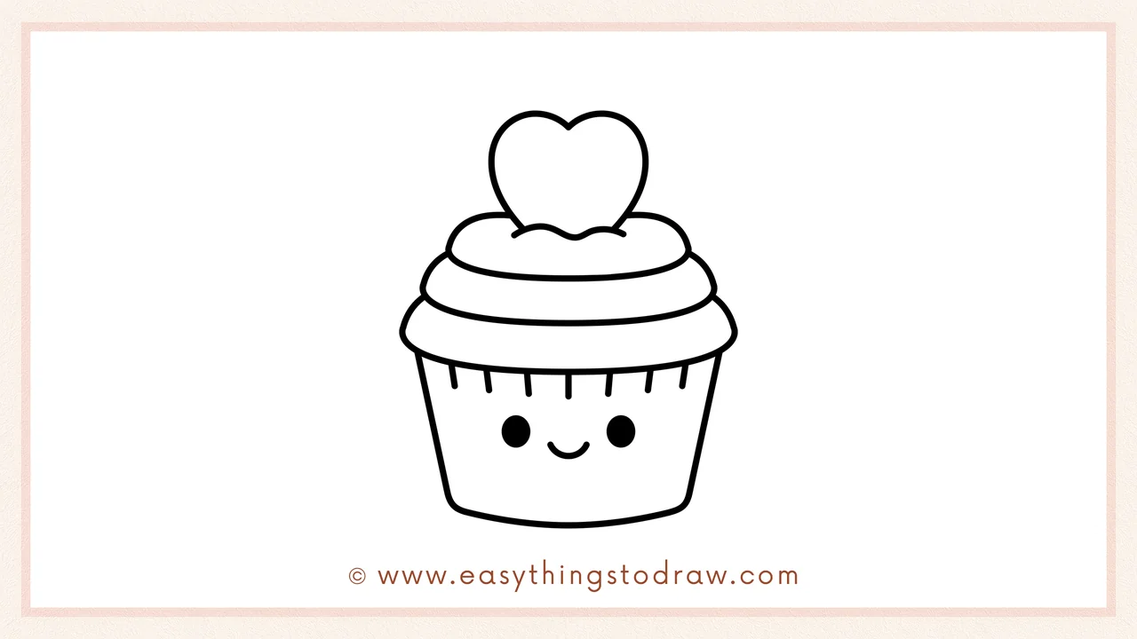 Step 6 of a simple valentines cupcake drawing tutorial – Adding two small eyes and a smiling mouth onto the cupcake wrapper to give it personality.