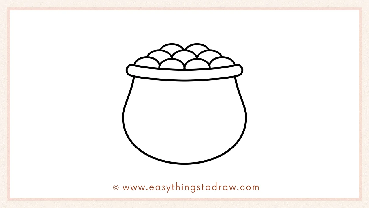 Step 5 of easy pot of gold drawing steps – Finishing the treasure pile by drawing a final third row of coins at the very top.