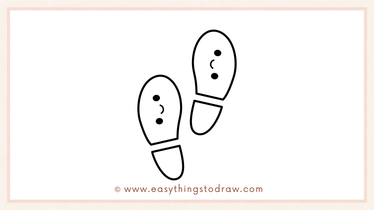Step 6 of simple St. Patrick's Day footprints drawing tutorial – Adding cute cartoon faces and coloring the footprints green.