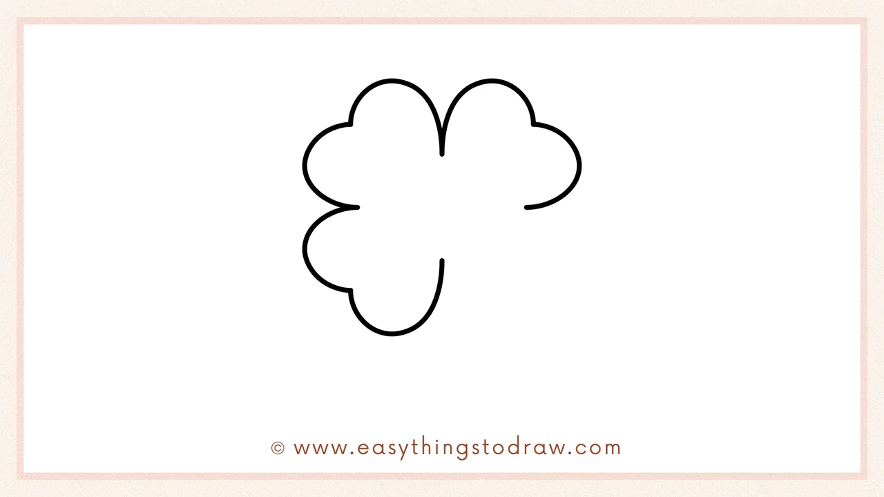 Step 3 of sketching a four-leaf clover for beginners – Two more rounded bumps are drawn, one on the left side and one at the bottom.