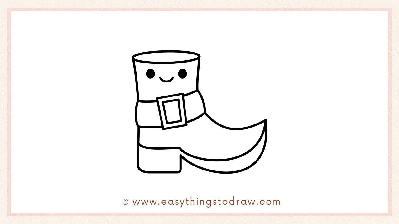 Step 6 of simple leprechaun boot drawing tutorial – Adding an optional cute smiley face with dot eyes above the buckle.